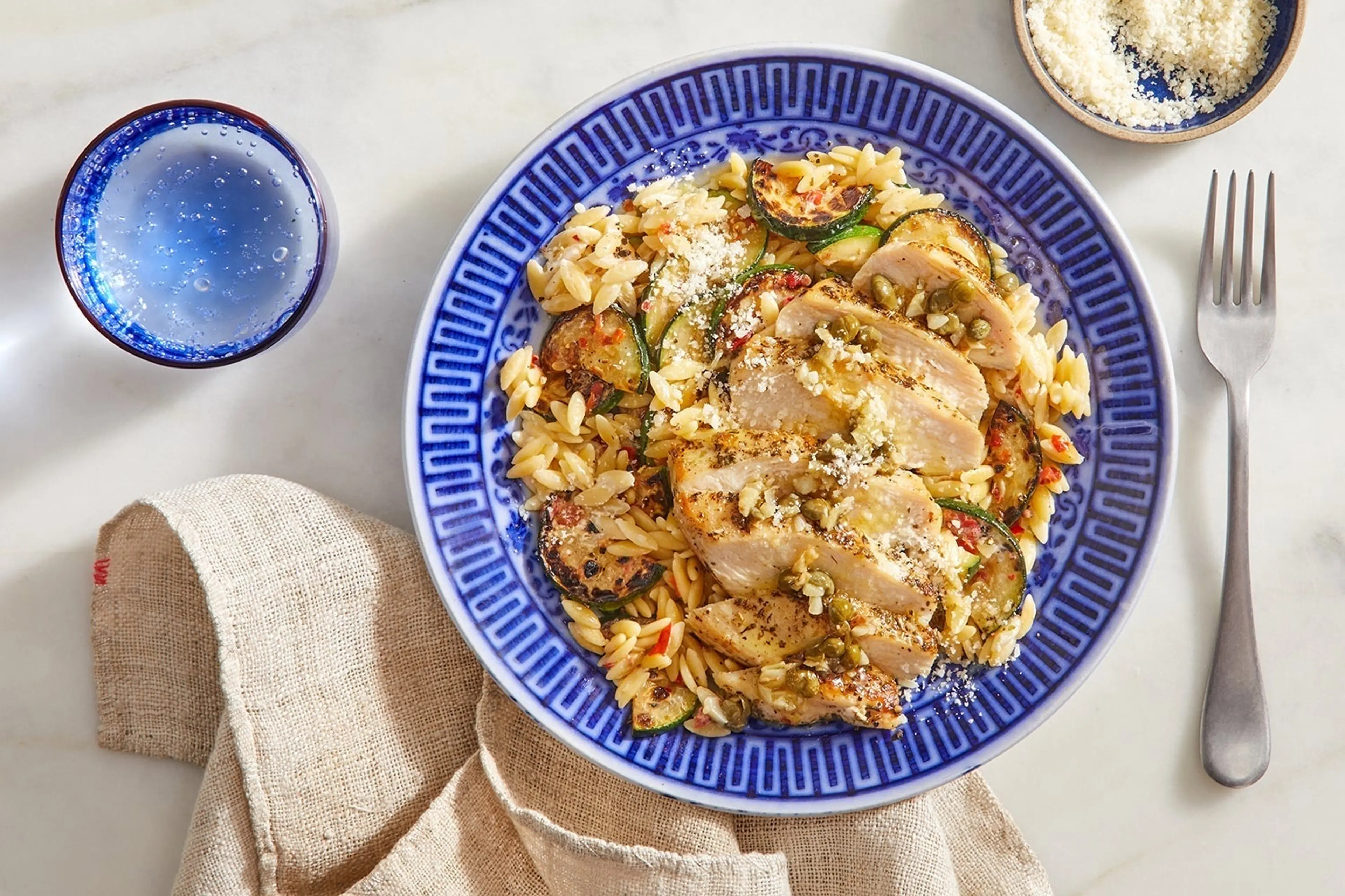 Lemon-Caper Chicken with Creamy Calabrian Zucchini & Orzo