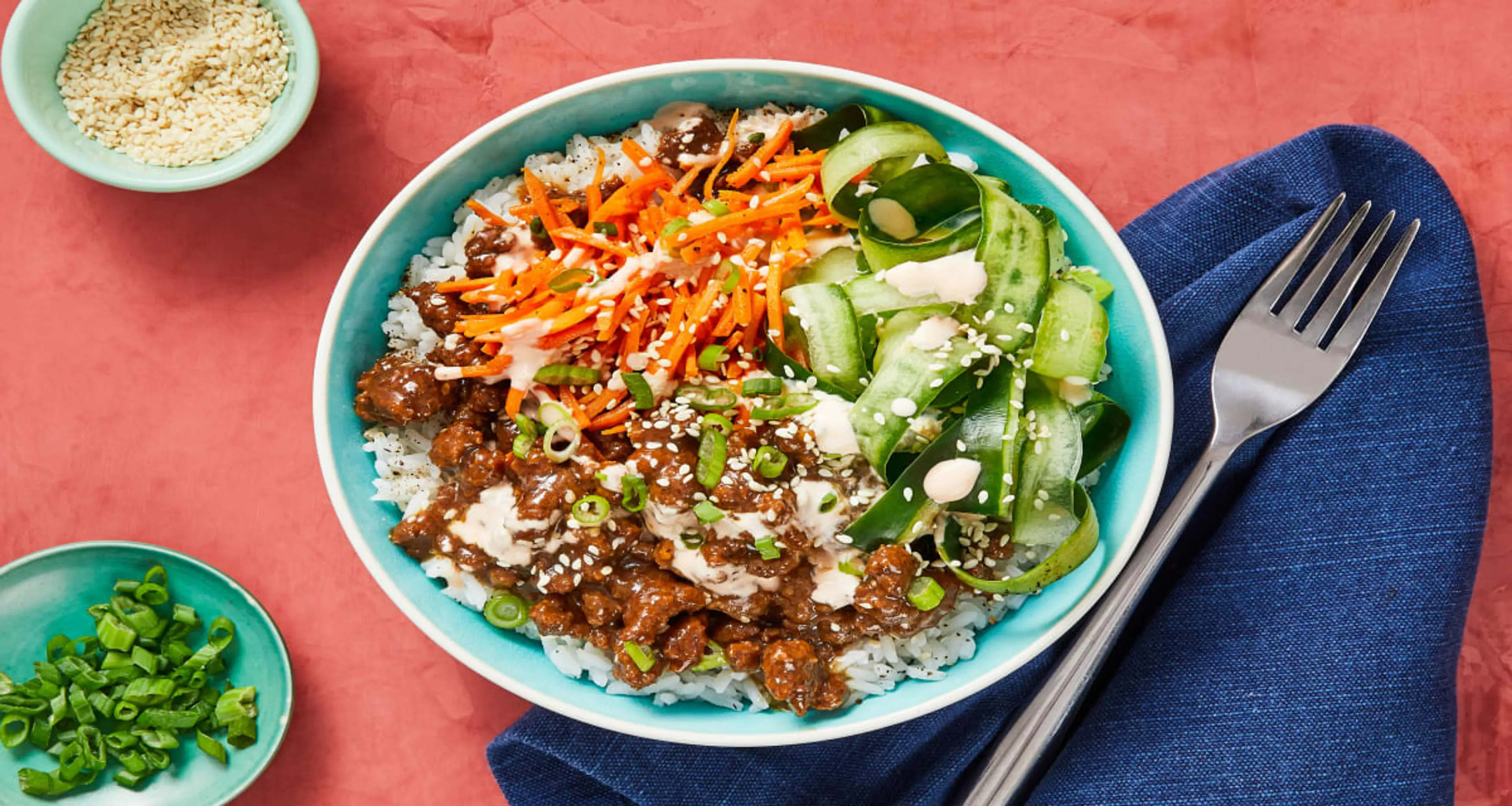 Beef Bulgogi Bowls with Carrots, Pickled Cucumber & Sriracha