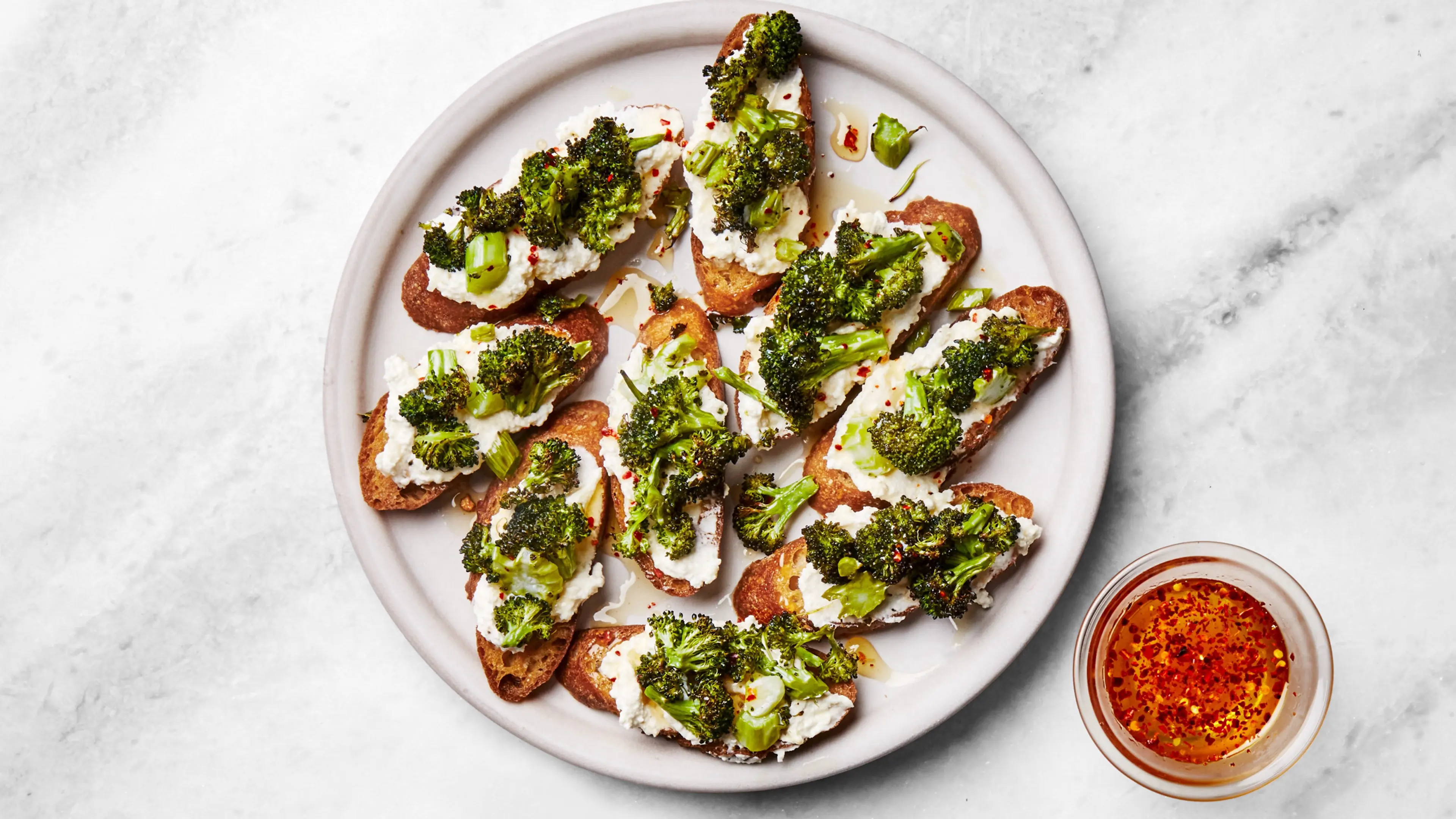 Broccoli and Garlic-Ricotta Toasts With Hot Honey