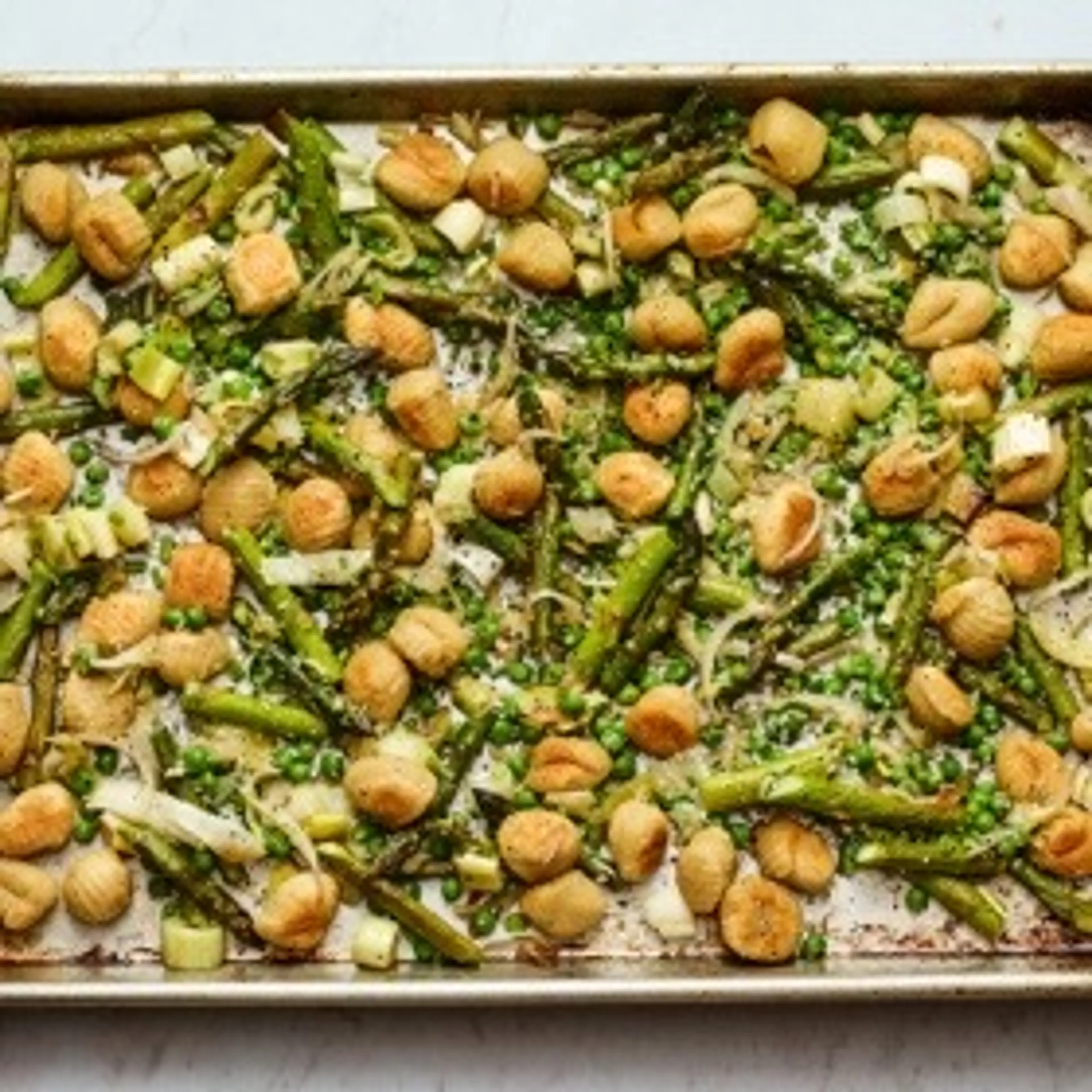 Sheet-Pan Gnocchi with Asparagus, Leeks and Peas