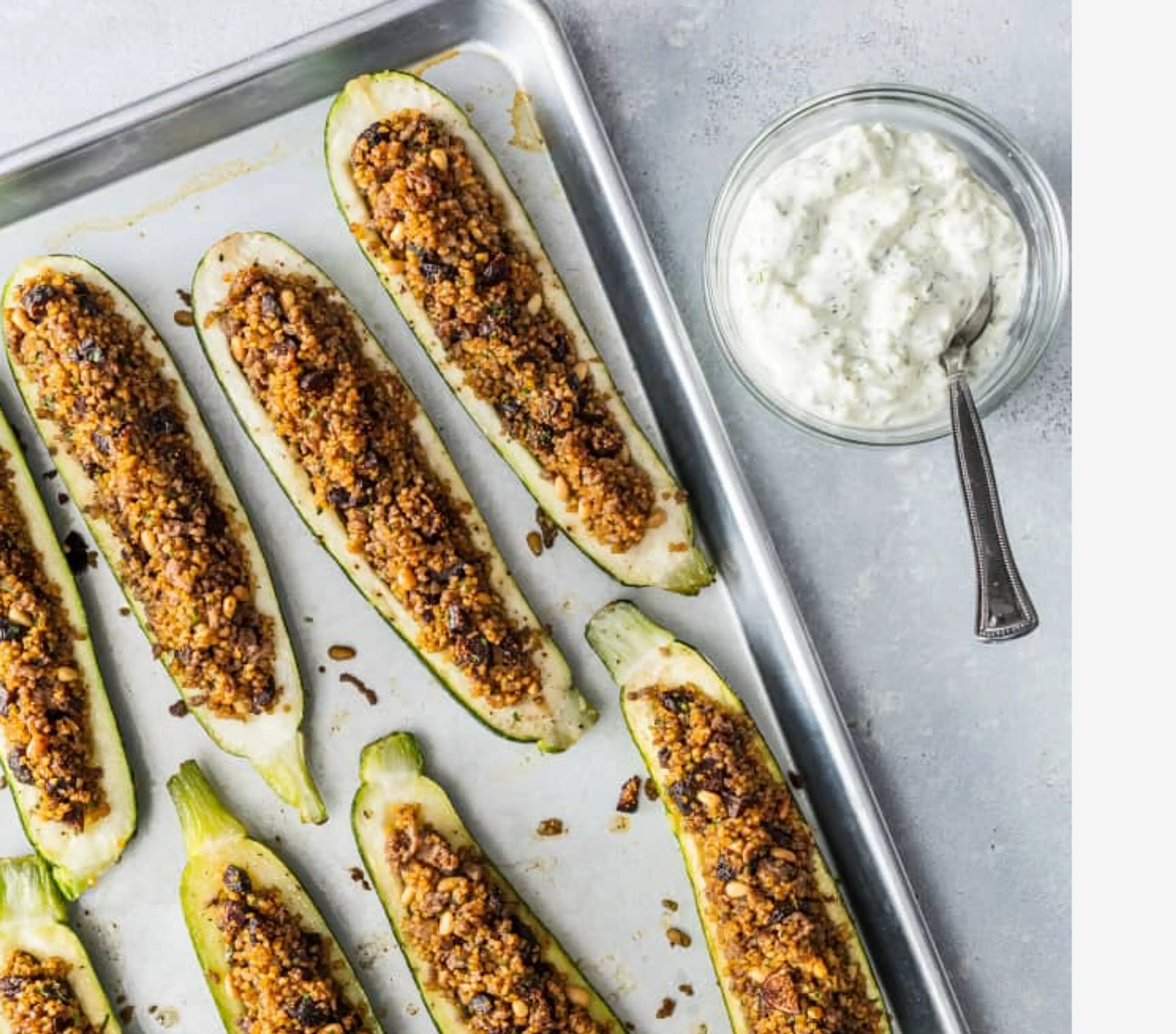 Stuffed Zucchini with spiced lamb, dried apricots, and pine