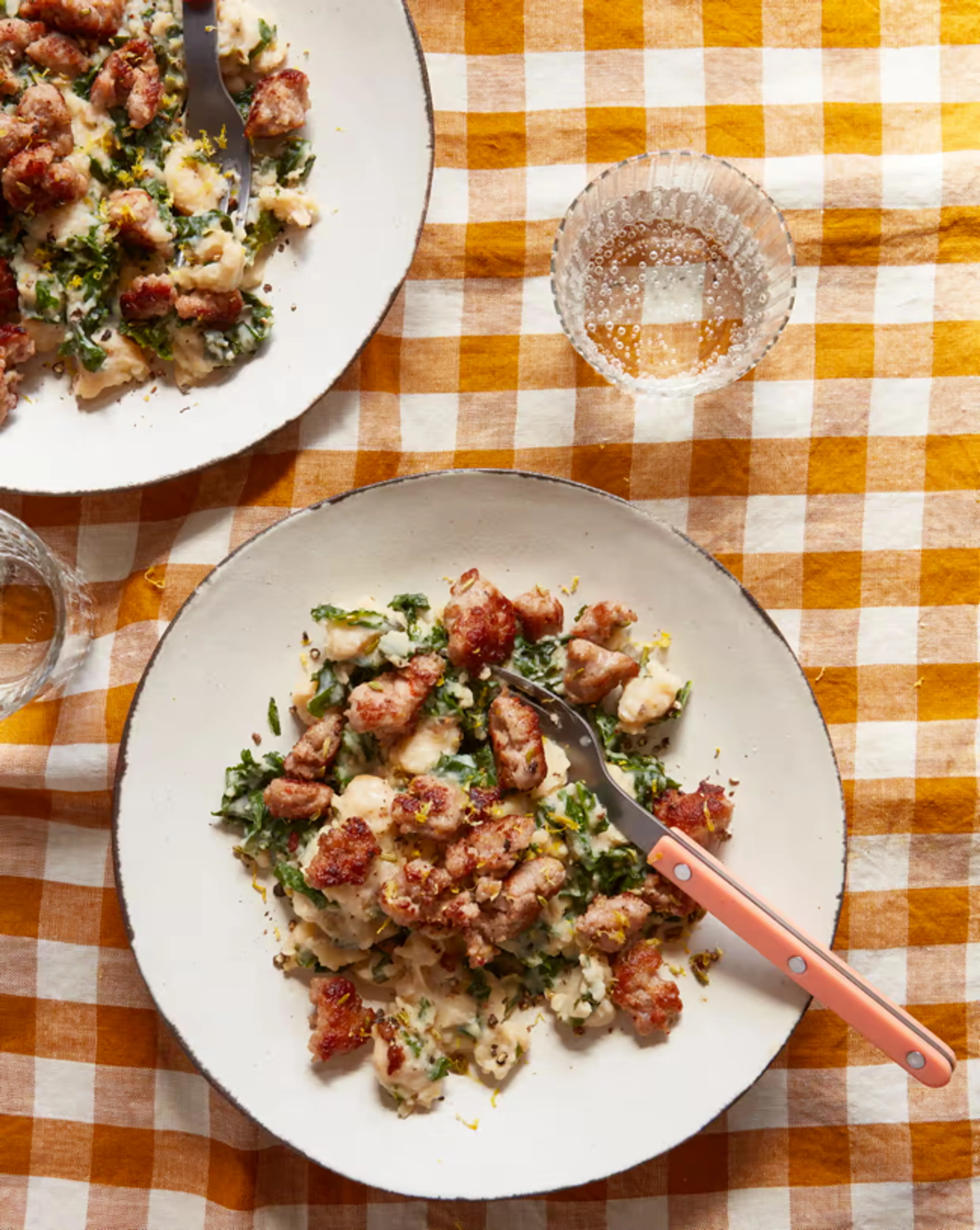 Butter bean mash with crisp sausage and lemony greens