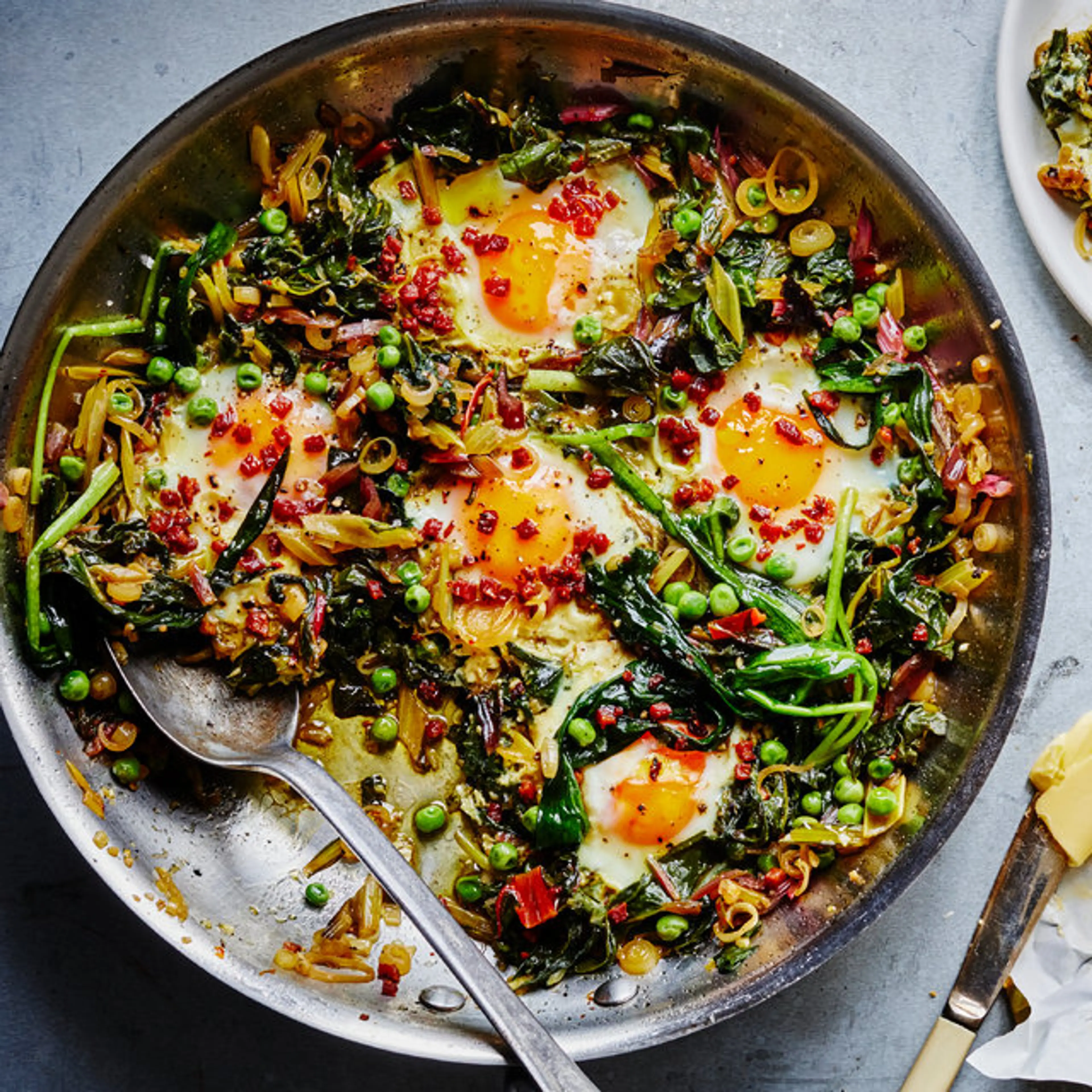 Skillet Greens With Runny Eggs, Peas and Pancetta