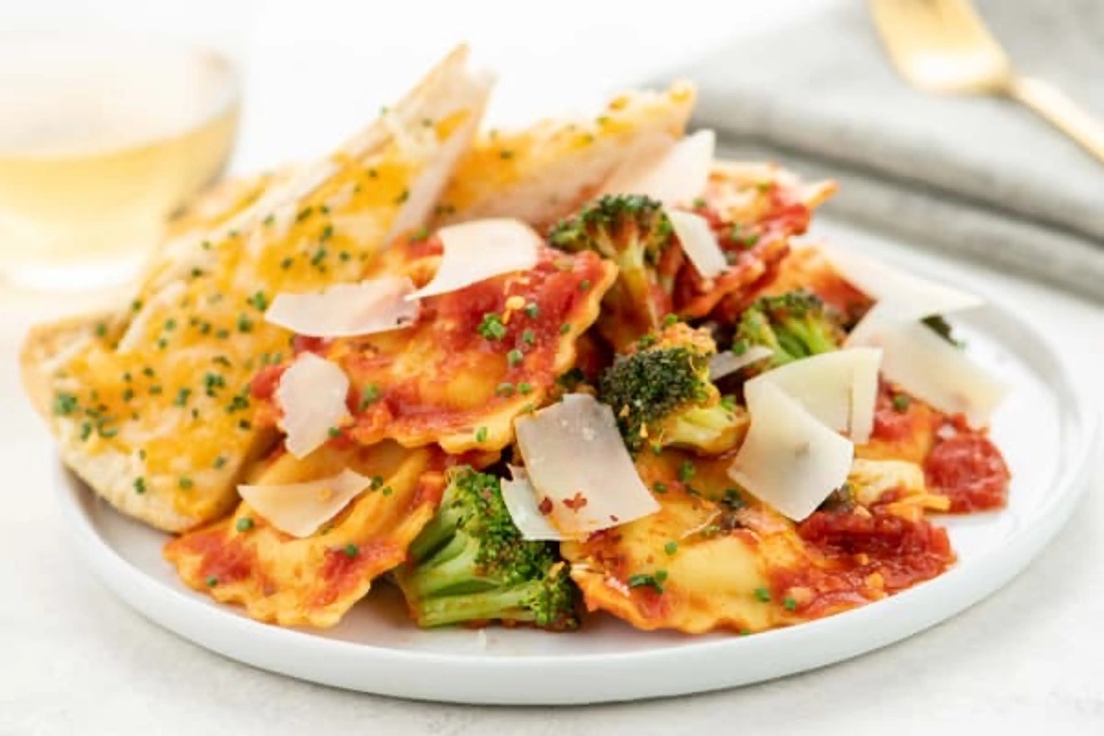 Shrimp and Lobster Diavolo Ravioli with broccoli and cheddar