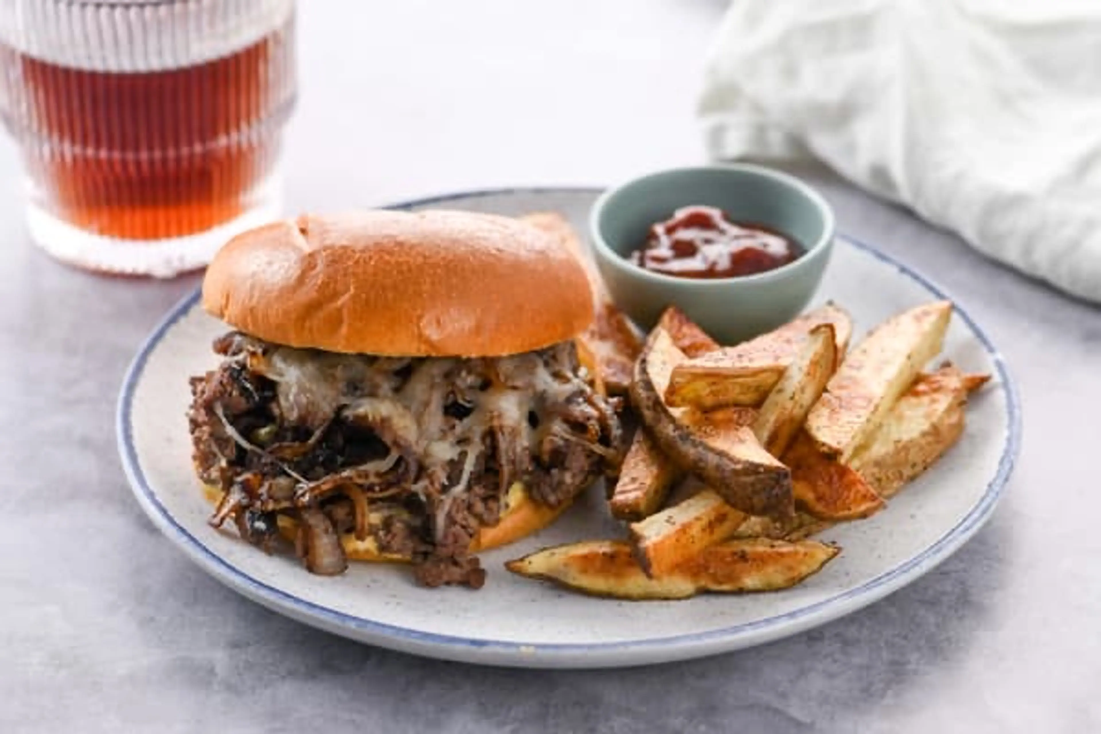 Onion, Fig, and Swiss Steak Sandwich with sweet and savory o