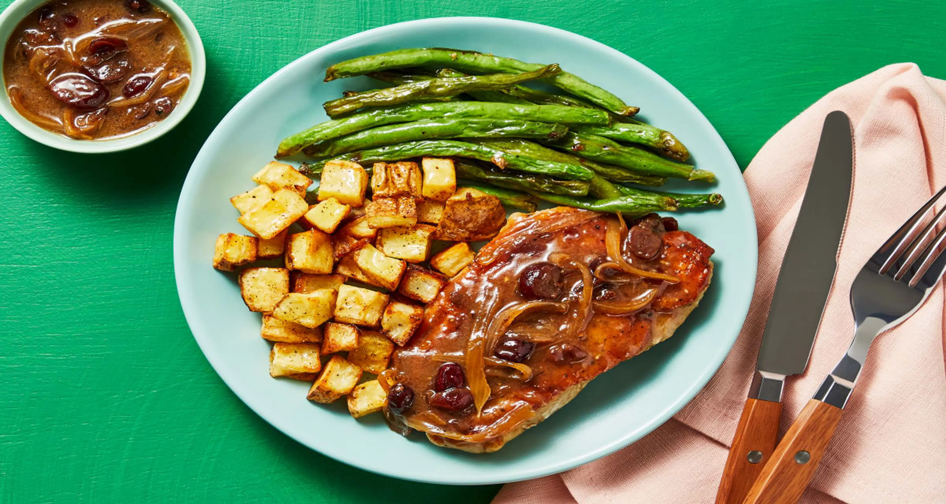 Pork Chops in Cranberry Shallot Sauce with Garlicky Roasted