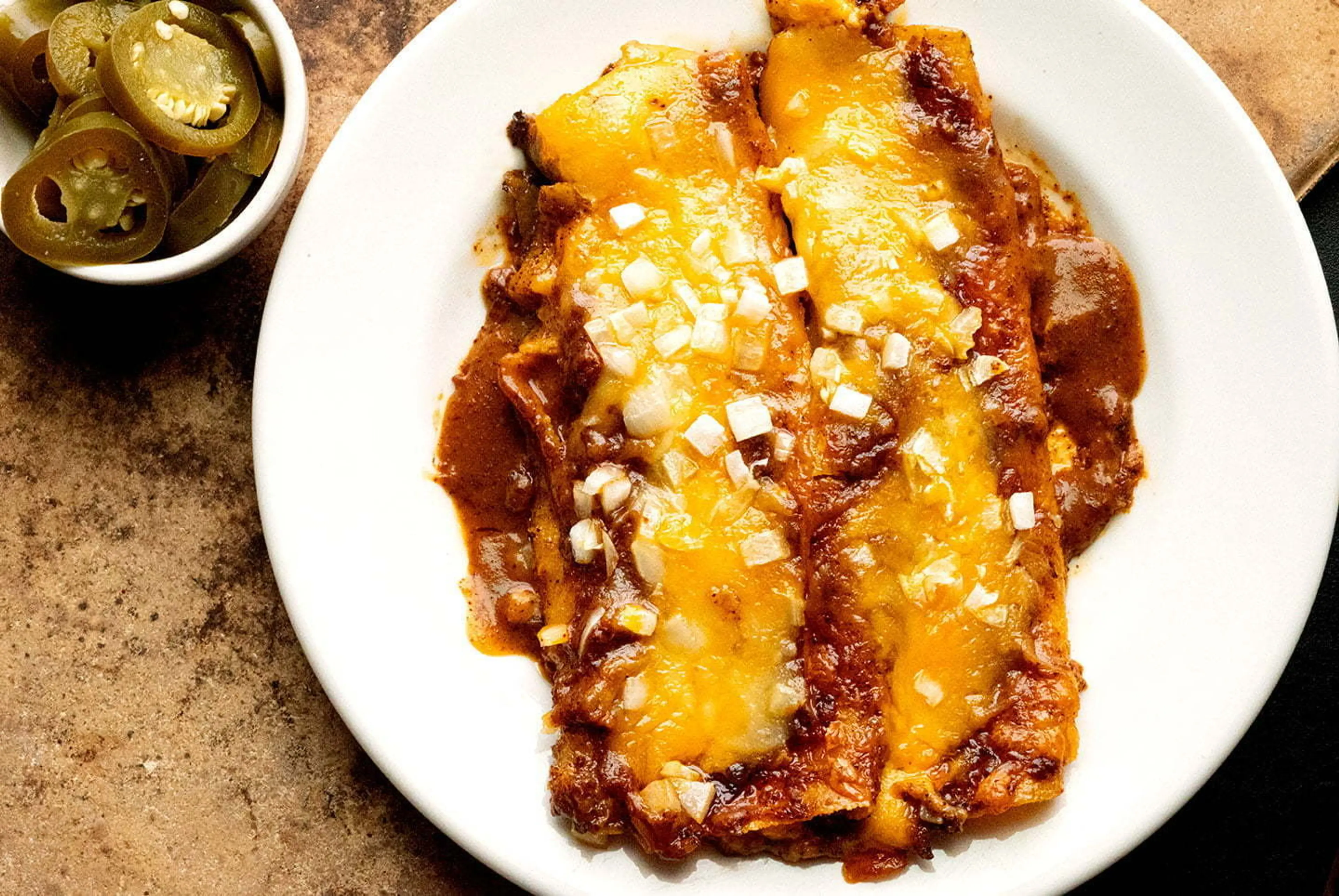 Cheese enchiladas with chili gravy