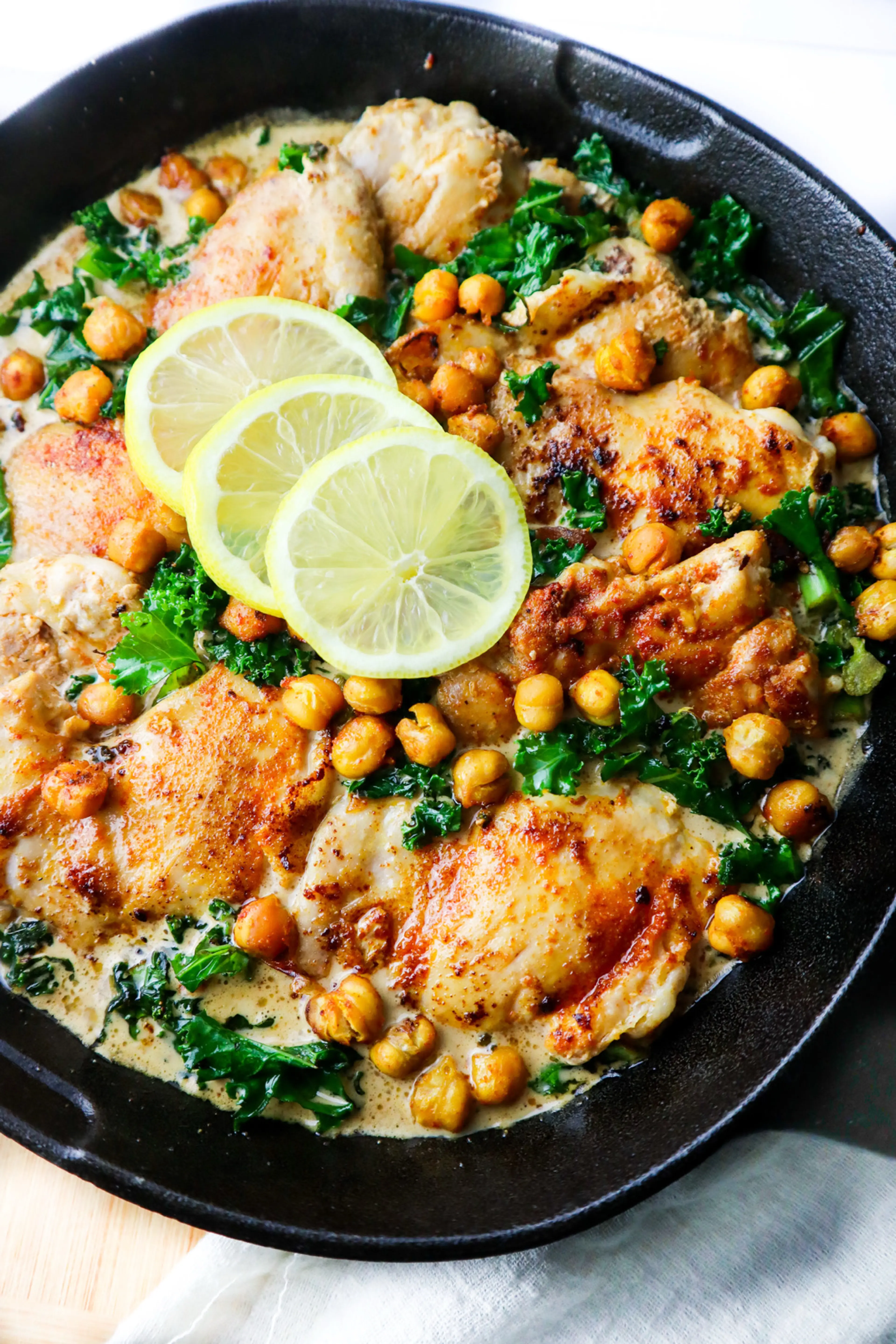 CREAMY LEMON CHICKEN THIGHS WITH KALE AND CHICKPEAS