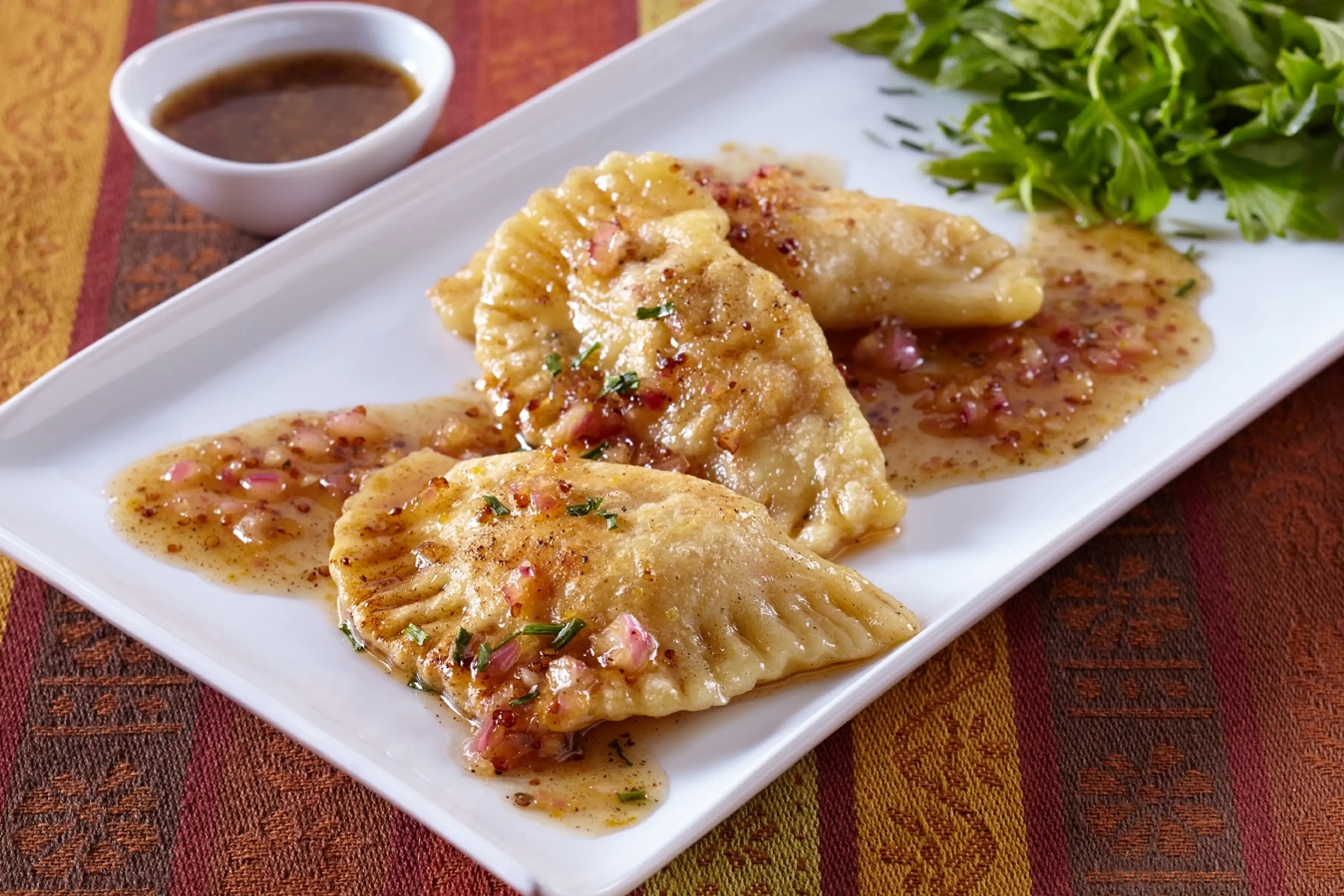 Idaho® Potato Pastrami Pierogi with Mustard Brown Vinaigrett