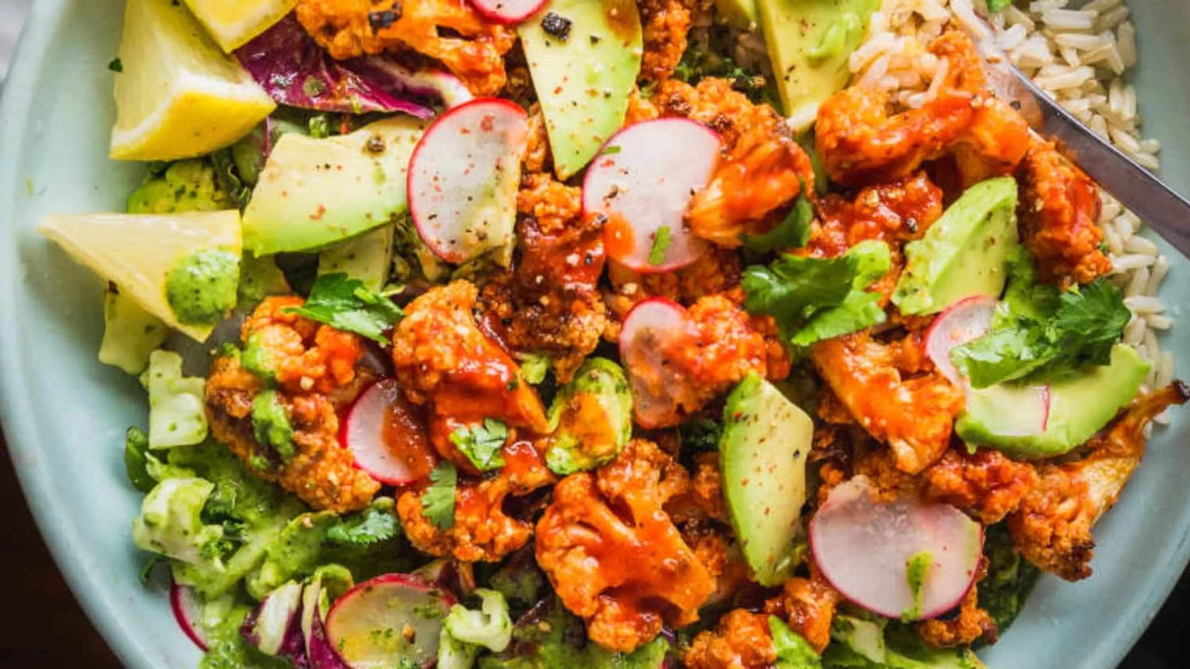 Recipe: Spicy Buffalo Cauliflower Bowls with Avocado and Gre