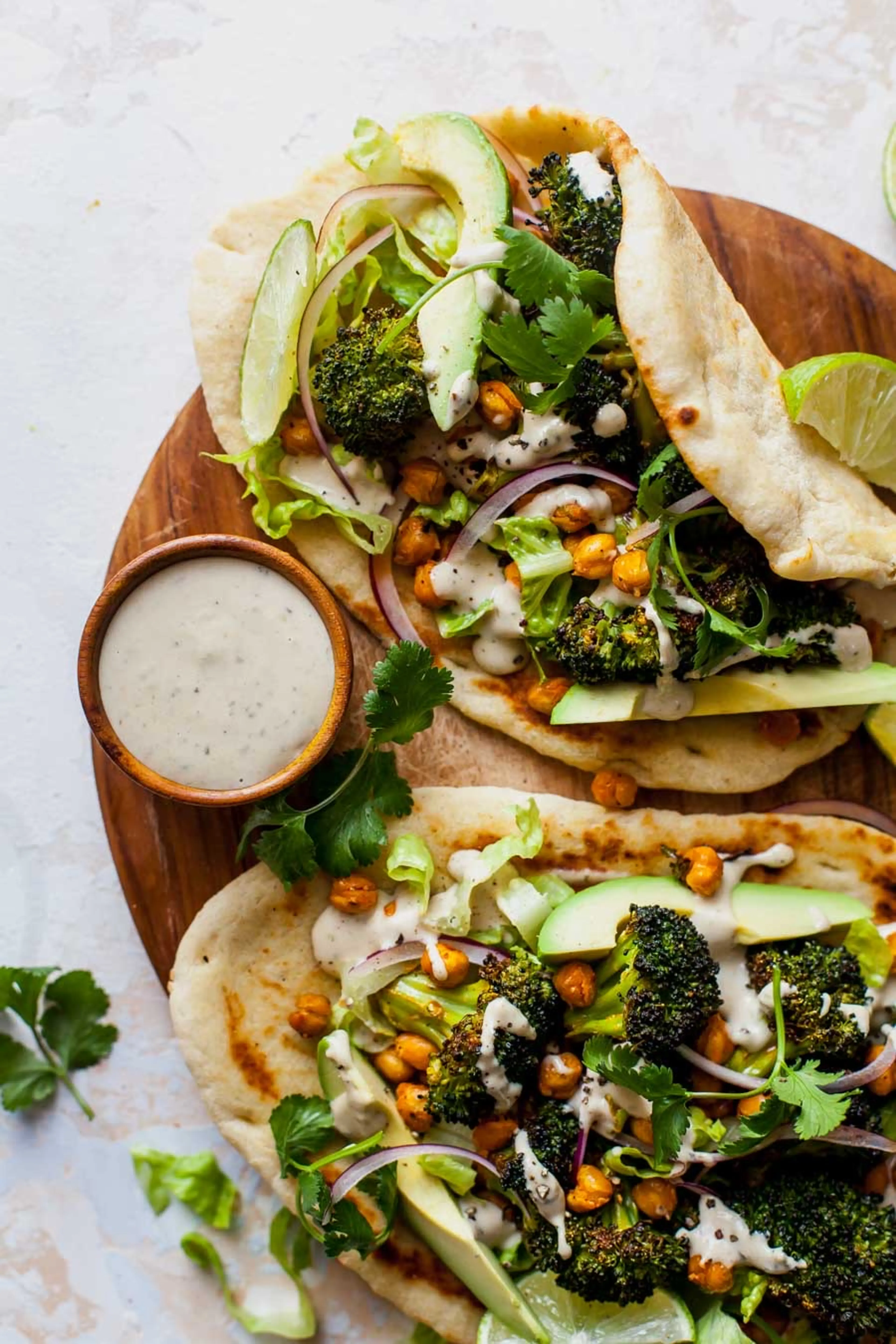 Buffalo Broccoli and Chickpea Pitas with Tahini Caesar